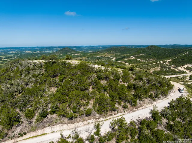 a view of a city with mountains in the background