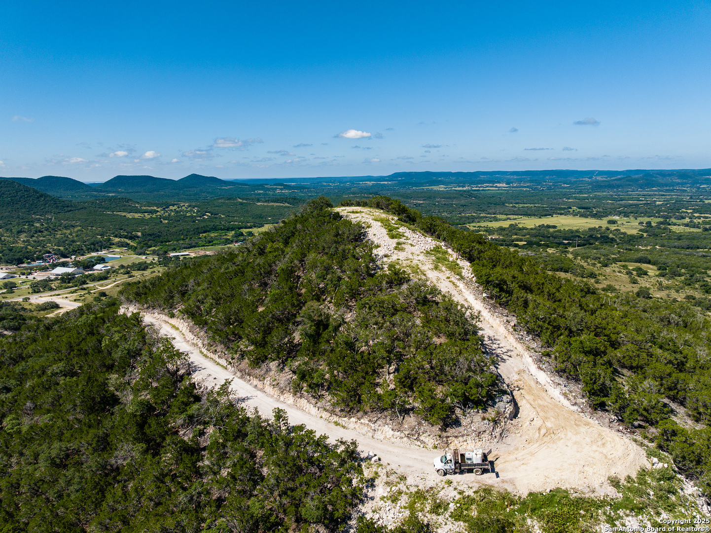 311 Jackson Way Tarpley, TX 78883 - Photo 20 of 47 a view of a lake with a mountain