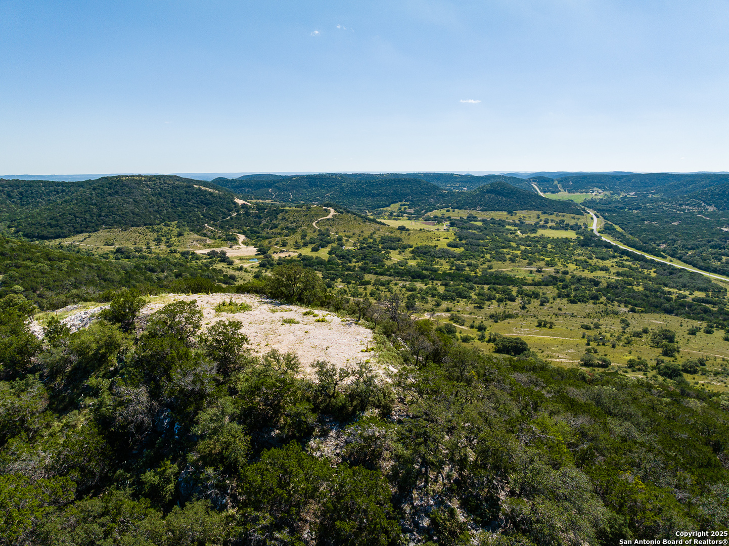 311 Jackson Way Tarpley, TX 78883 - Photo 31 of 47 an aerial view of residential houses with outdoor space and trees