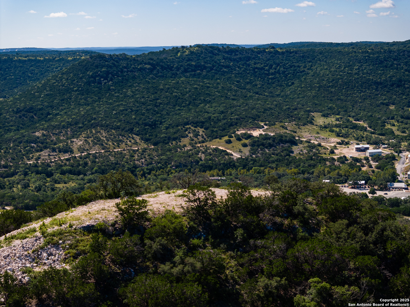 311 Jackson Way Tarpley, TX 78883 - Photo 40 of 47 a view of a lake in middle of green field