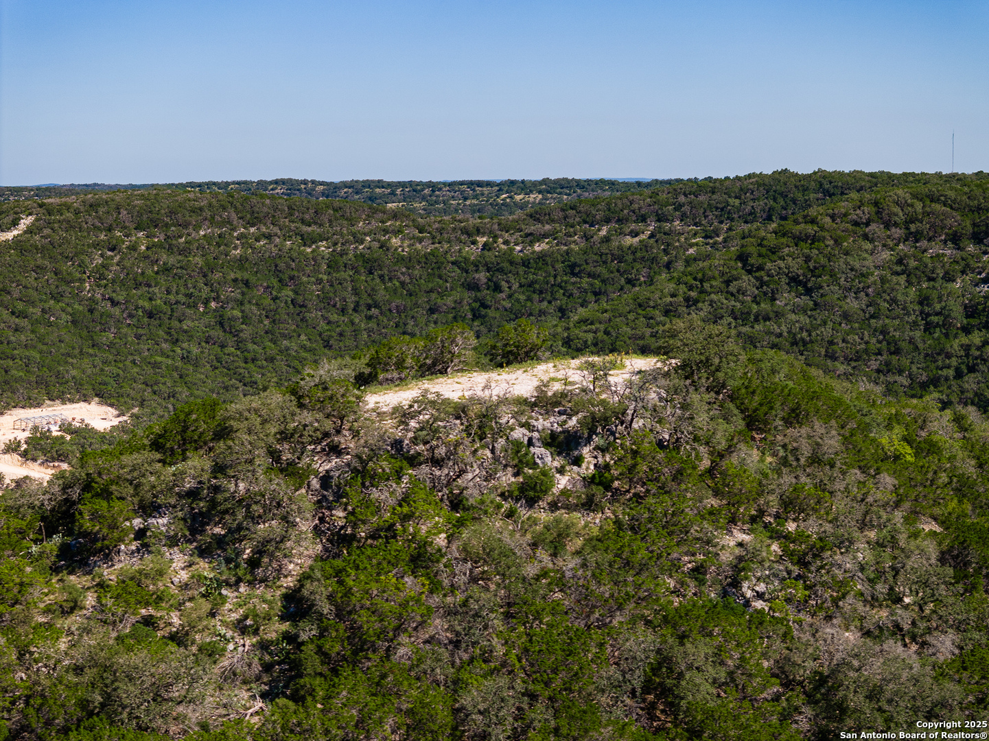 311 Jackson Way Tarpley, TX 78883 - Photo 47 of 47 a view of a large body of water with a building in background