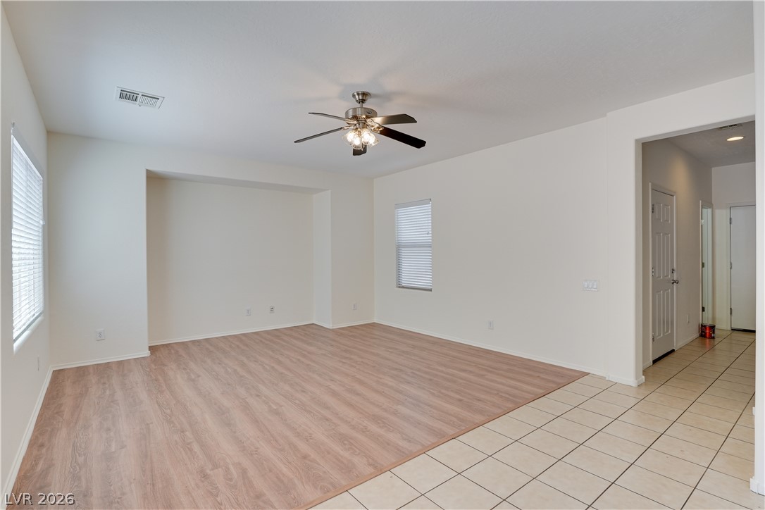 2717 Rimbaud Street Henderson, NV 89044 - Photo 8 of 34 A well-lit living space features diverse flooring, ready for personalization.