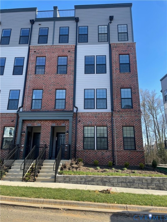 13327 Coalfield Station Lane Midlothian, VA 23114 - Photo 1 of 10 a brick building that has lots of windows on it