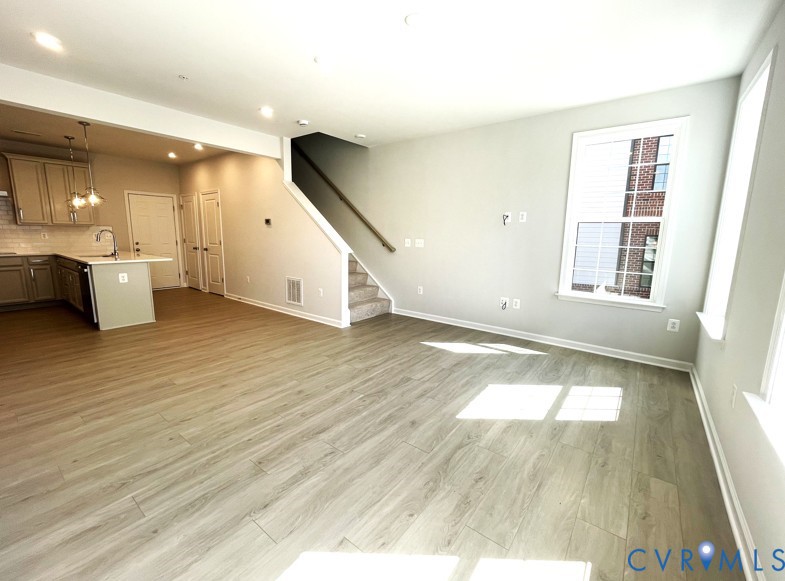 13327 Coalfield Station Lane Midlothian, VA 23114 - Photo 2 of 10 an empty room with wooden floor and windows