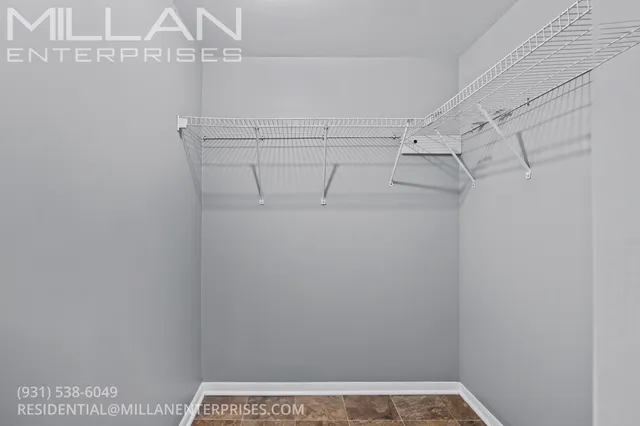 a view of a room with racks on the wall