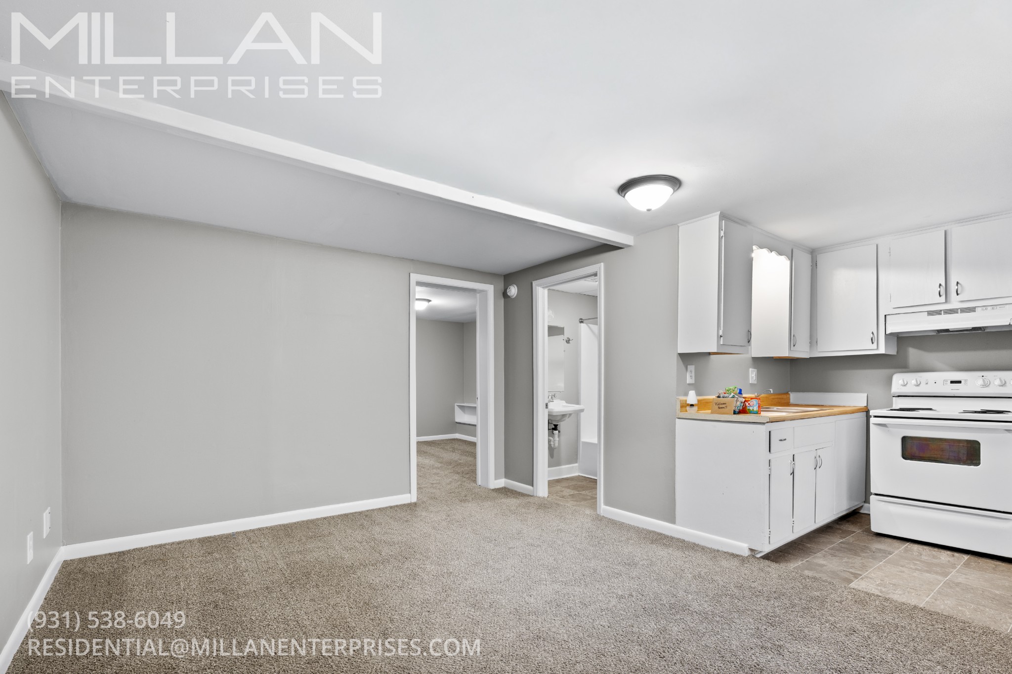 187 Delmar Drive, Unit C Clarksville, TN 37040 - Photo 2 of 13 a kitchen with stainless steel appliances granite countertop a stove a sink and a refrigerator