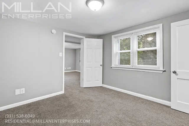 a view of empty room with windows