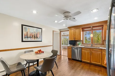 a view of a dining room with furniture window and wooden floor
