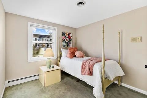 a bed room with a bed and a window