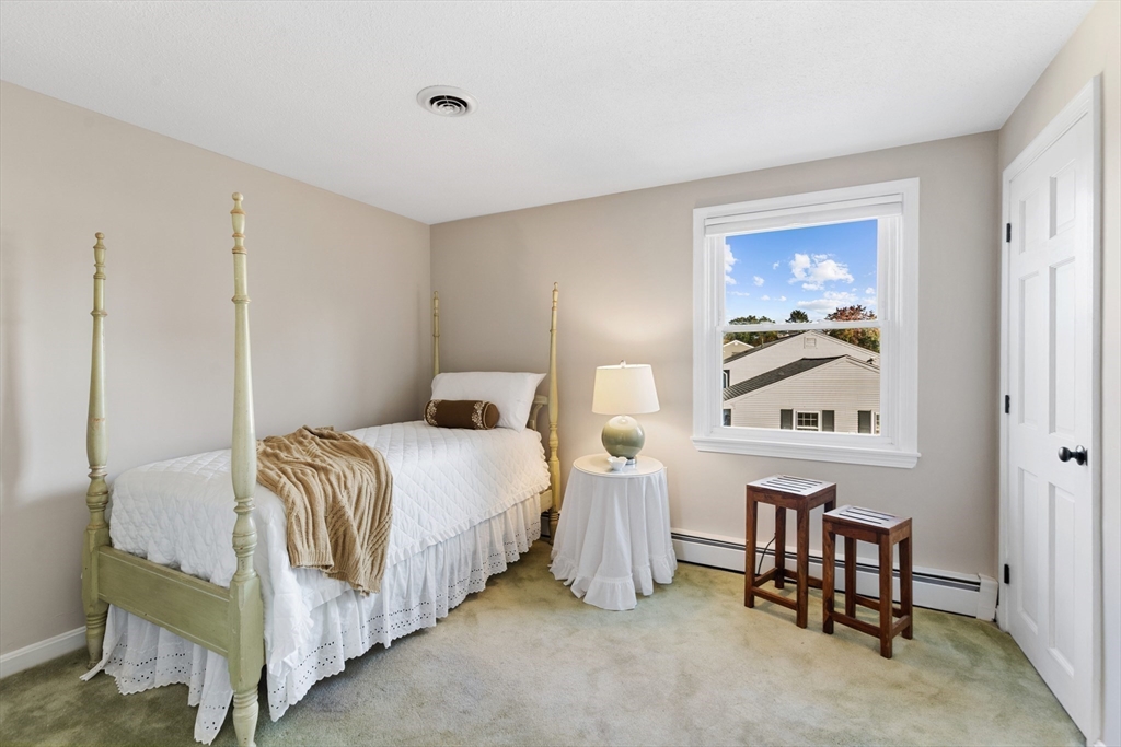 41 Mohawk Street Danvers, MA 01923 - Photo 17 of 36 a bedroom with a bed and a painting on the wall