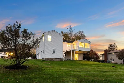 a front view of a house with a yard