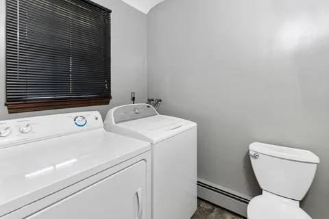 a bathroom with a toilet and a sink