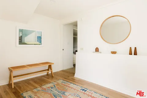 a view of a livingroom with furniture and wooden floor