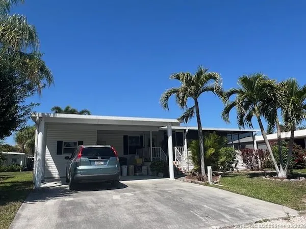 a view of a car park in front of house