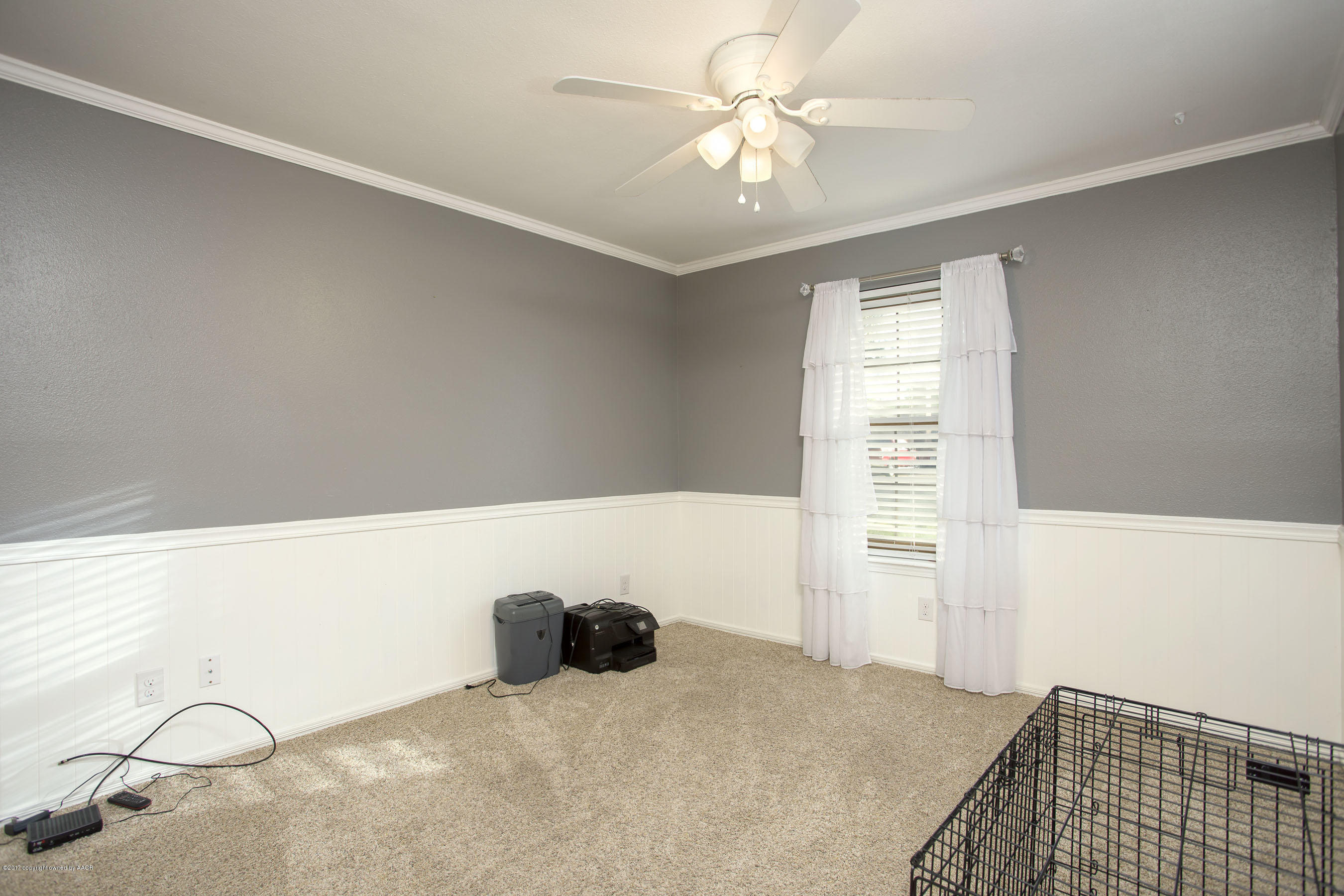 8324 Lamount Drive Amarillo, TX 79110 - Photo 13 of 26 a bedroom with a bed and a chandelier