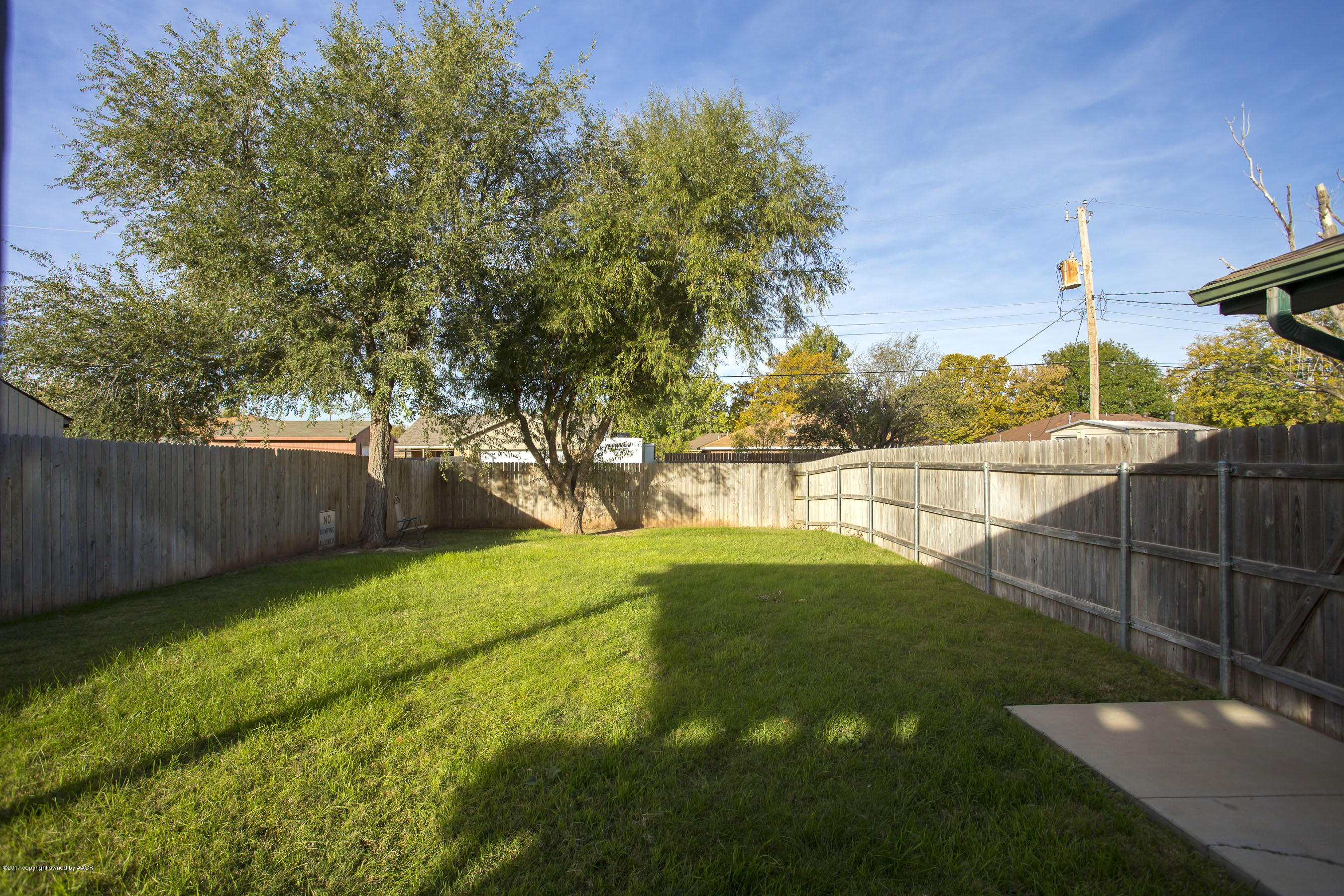 8324 Lamount Drive Amarillo, TX 79110 - Photo 24 of 26 a view of a backyard with large trees