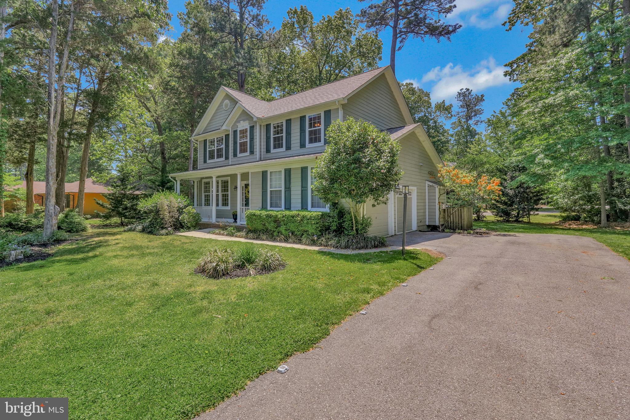 11587 Wollaston Circle Swan Point, MD 20645 - Photo 2 of 55 a view of house with yard and green space