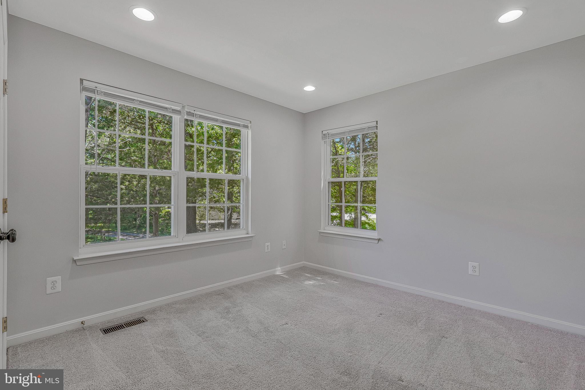11587 Wollaston Circle Swan Point, MD 20645 - Photo 27 of 55 an empty room with windows