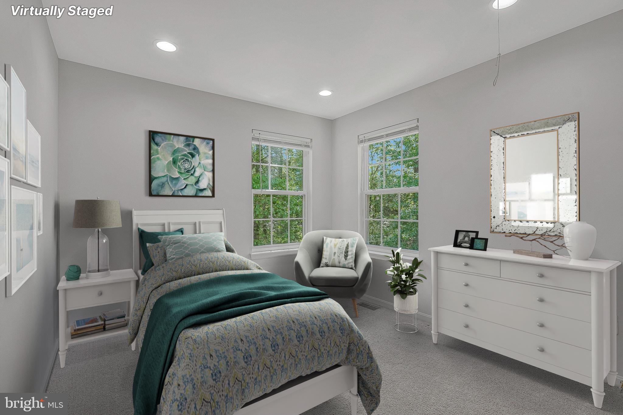 11587 Wollaston Circle Swan Point, MD 20645 - Photo 30 of 55 a bedroom with a bed and a couch