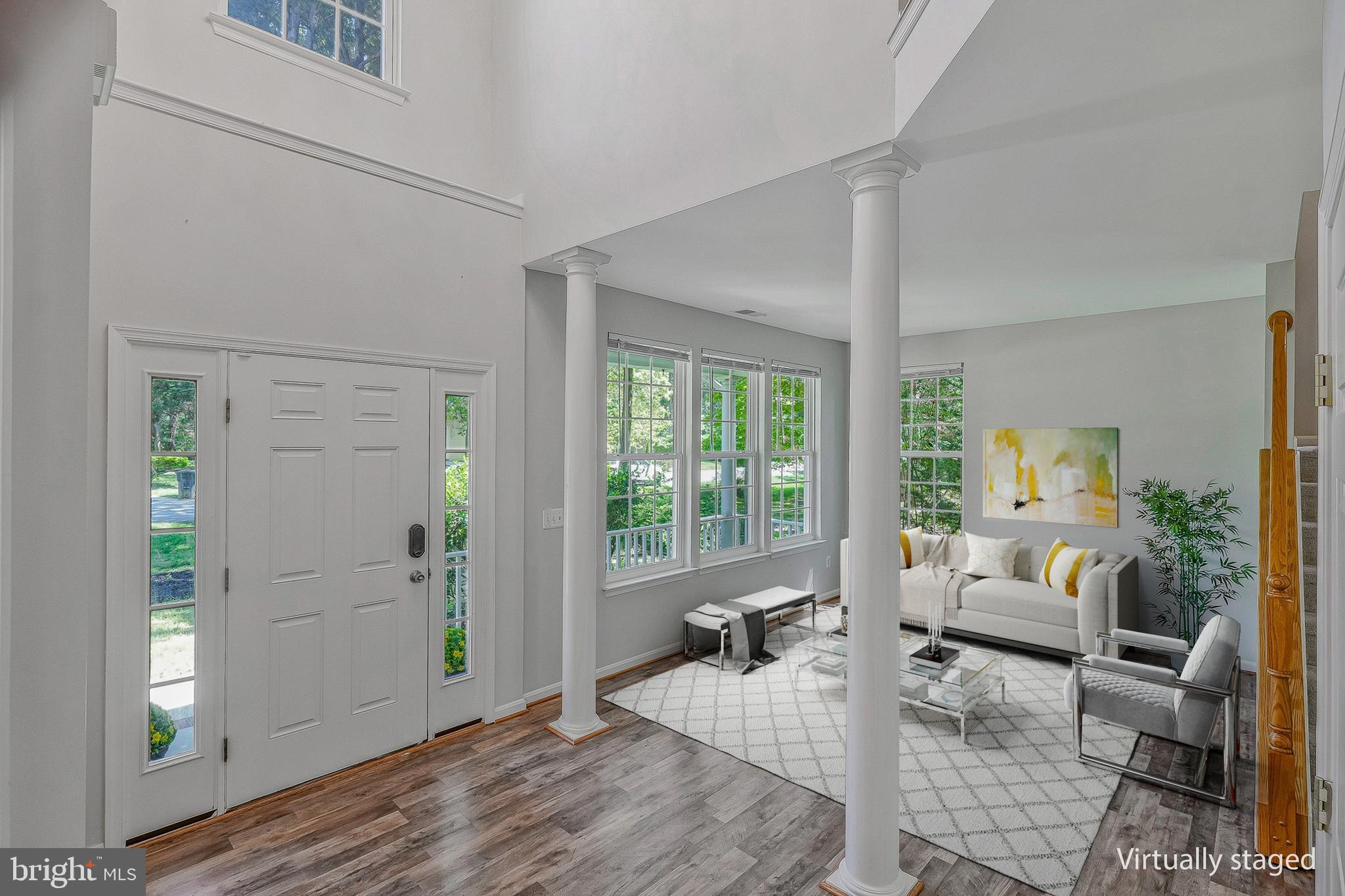 11587 Wollaston Circle Swan Point, MD 20645 - Photo 3 of 55 a living room with furniture and a window
