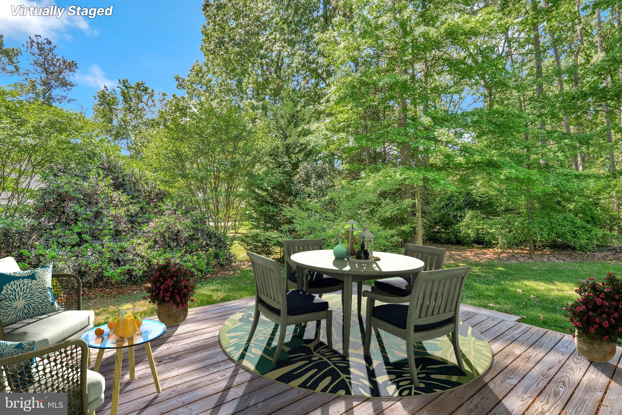11587 Wollaston Circle Swan Point, MD 20645 - Photo 38 of 55 a view of a table and chairs in the patio