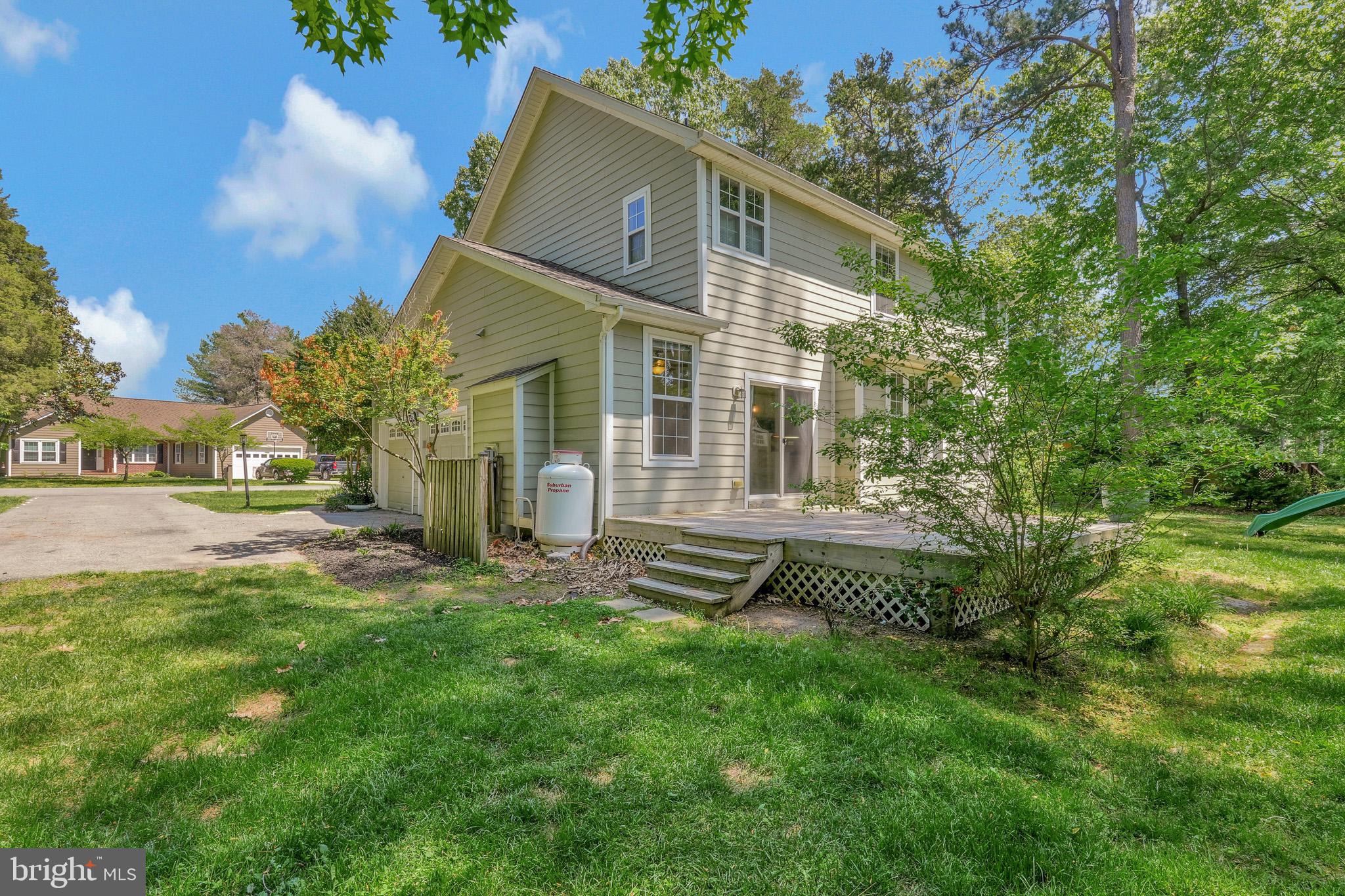11587 Wollaston Circle Swan Point, MD 20645 - Photo 41 of 55 a front view of a house with a yard