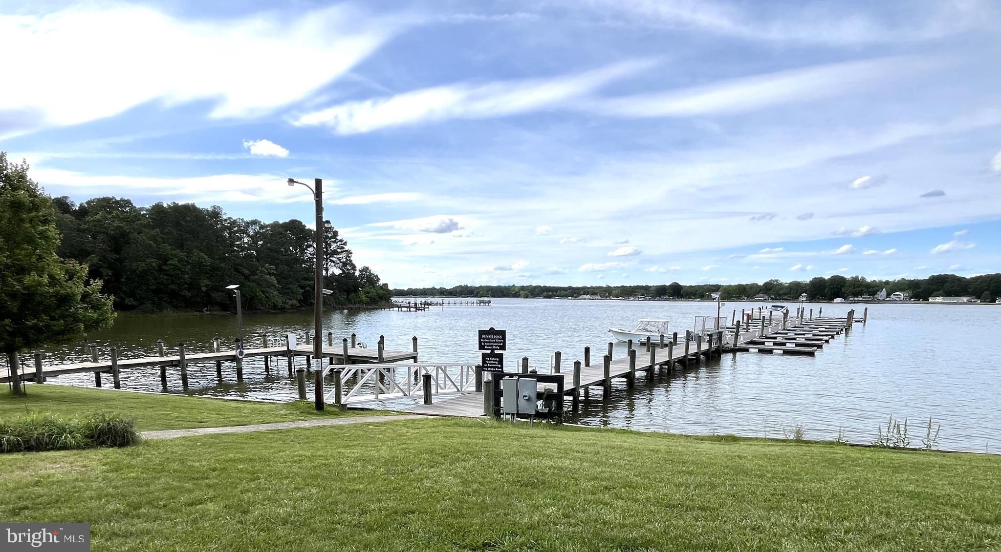 11587 Wollaston Circle Swan Point, MD 20645 - Photo 45 of 55 a view of a lake and houses with outdoor space