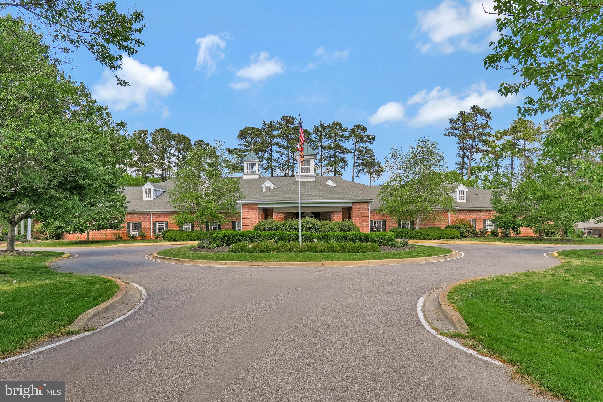 11587 Wollaston Circle Swan Point, MD 20645 - Photo 50 of 55 front view of a house with a yard and an trees