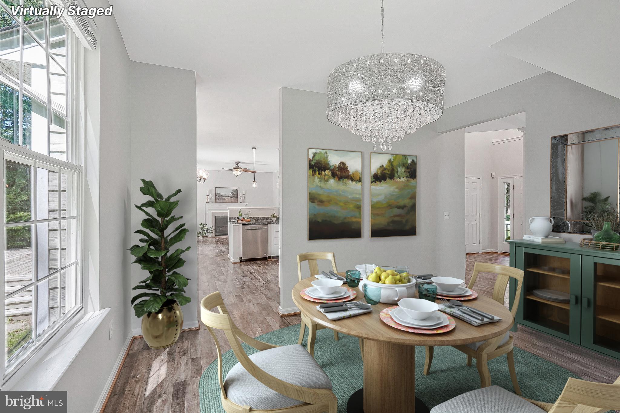 11587 Wollaston Circle Swan Point, MD 20645 - Photo 8 of 55 a view of a dining room with furniture wooden floor and chandelier