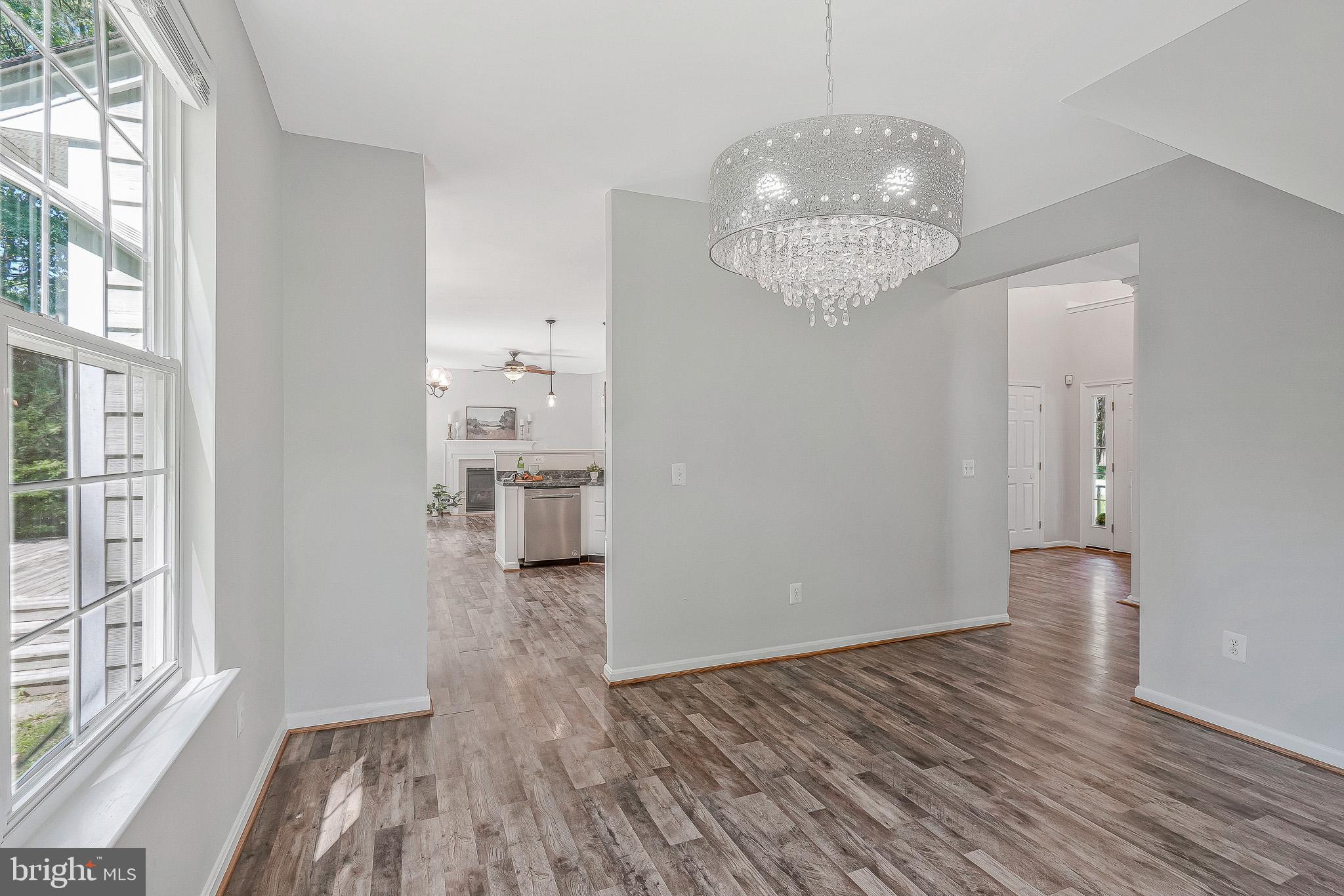 11587 Wollaston Circle Swan Point, MD 20645 - Photo 9 of 55 a view of empty room with wooden floor