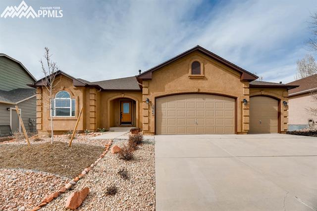 1944 Coldstone Way Colorado Springs, CO 80921 - Photo 2 of 23 Brand new exterior paint and 3 car garage!