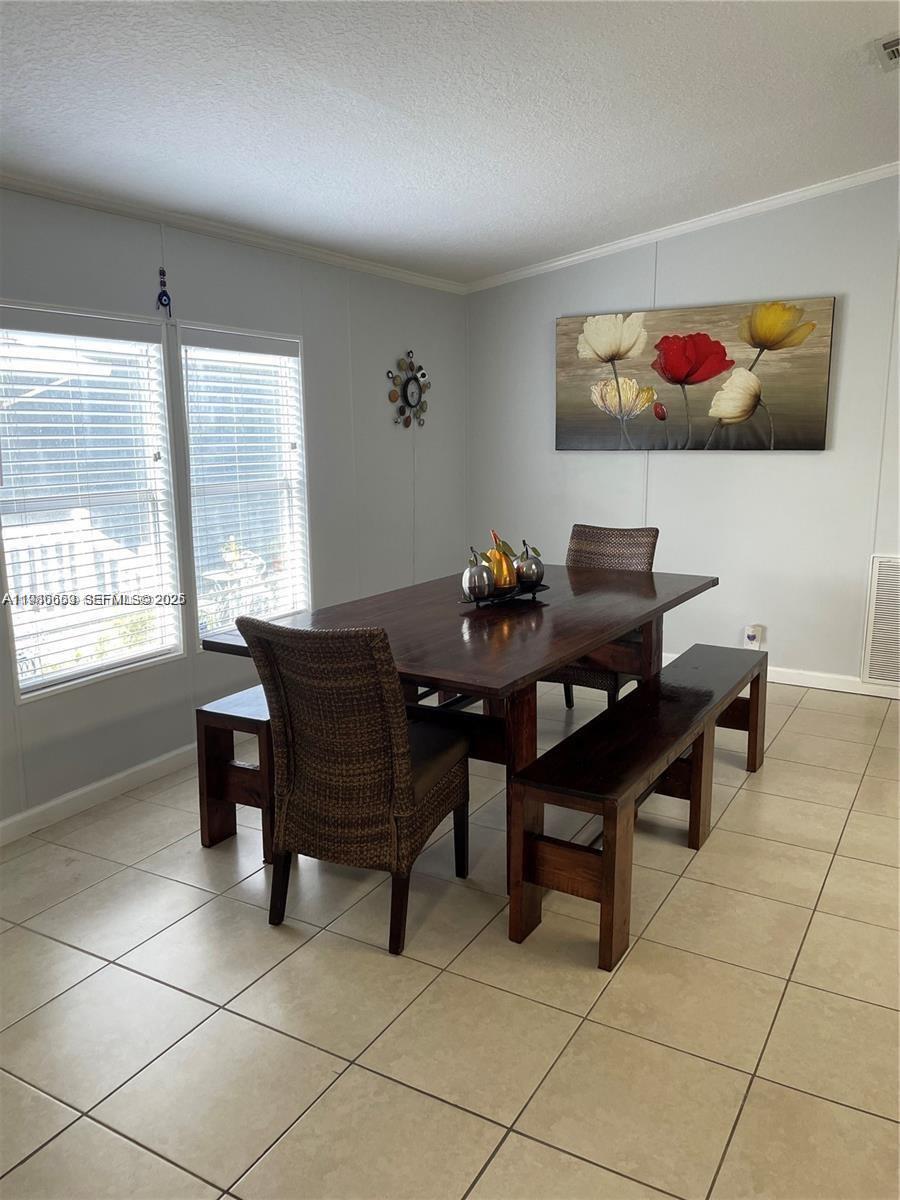 19800 Southwest 180th Avenue Miami, FL 33187 - Photo 3 of 9 a view of a dining room with furniture