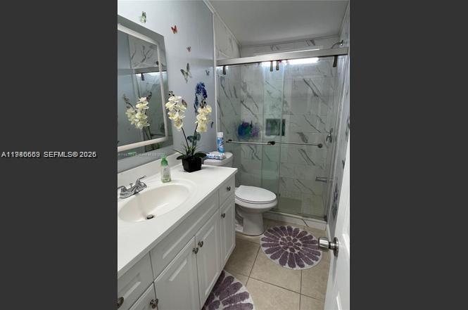 19800 Southwest 180th Avenue Miami, FL 33187 - Photo 8 of 9 a bathroom with a sink toilet and shower