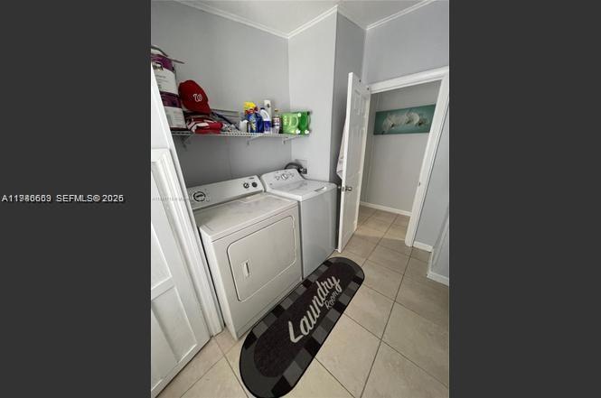 19800 Southwest 180th Avenue Miami, FL 33187 - Photo 9 of 9 a utility room with dryer and washer