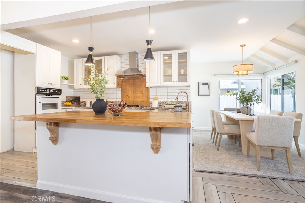 a kitchen with a sink cabinets and window