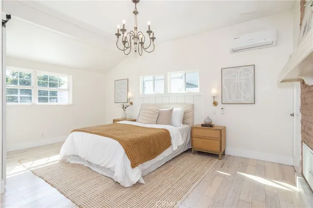 a bedroom with bed and a window