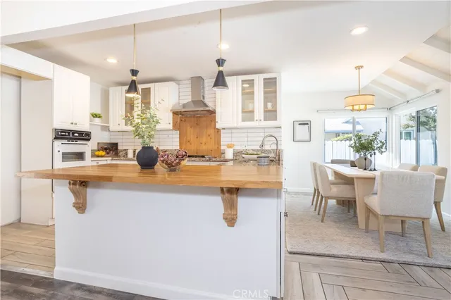 a kitchen with a sink cabinets and window
