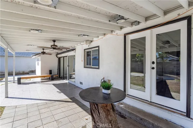 a view of a porch with seating space