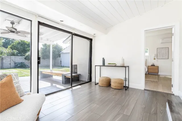 a view of a living room and a floor to ceiling window