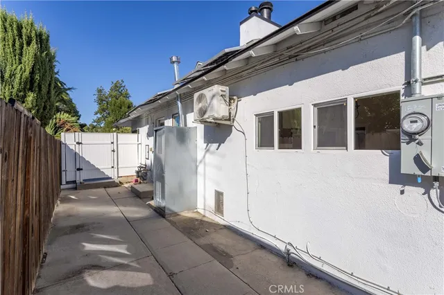 a view of a house with wooden floor and fence