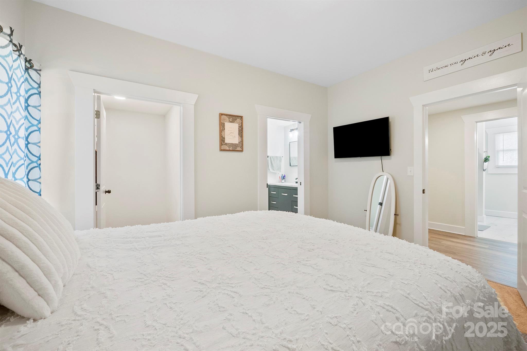 600 3rd Street Spencer, NC 28159 - Photo 12 of 27 a bedroom with a bed and a flat screen tv