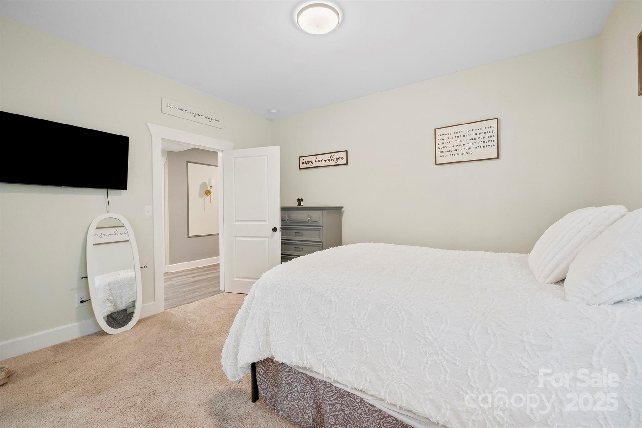 600 3rd Street Spencer, NC 28159 - Photo 13 of 27 a bedroom with a bed and a flat screen tv