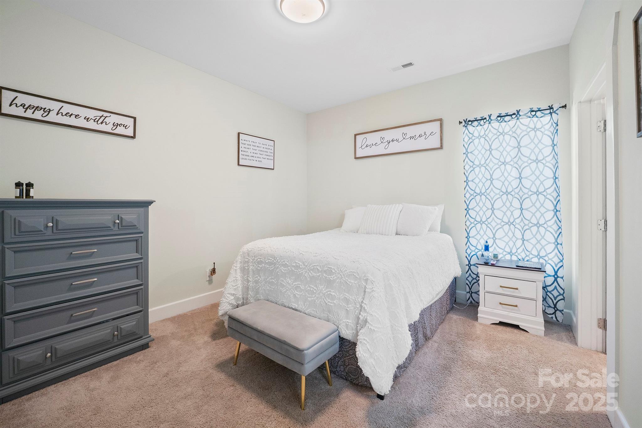 600 3rd Street Spencer, NC 28159 - Photo 14 of 27 a bedroom with a bed and a cabinets