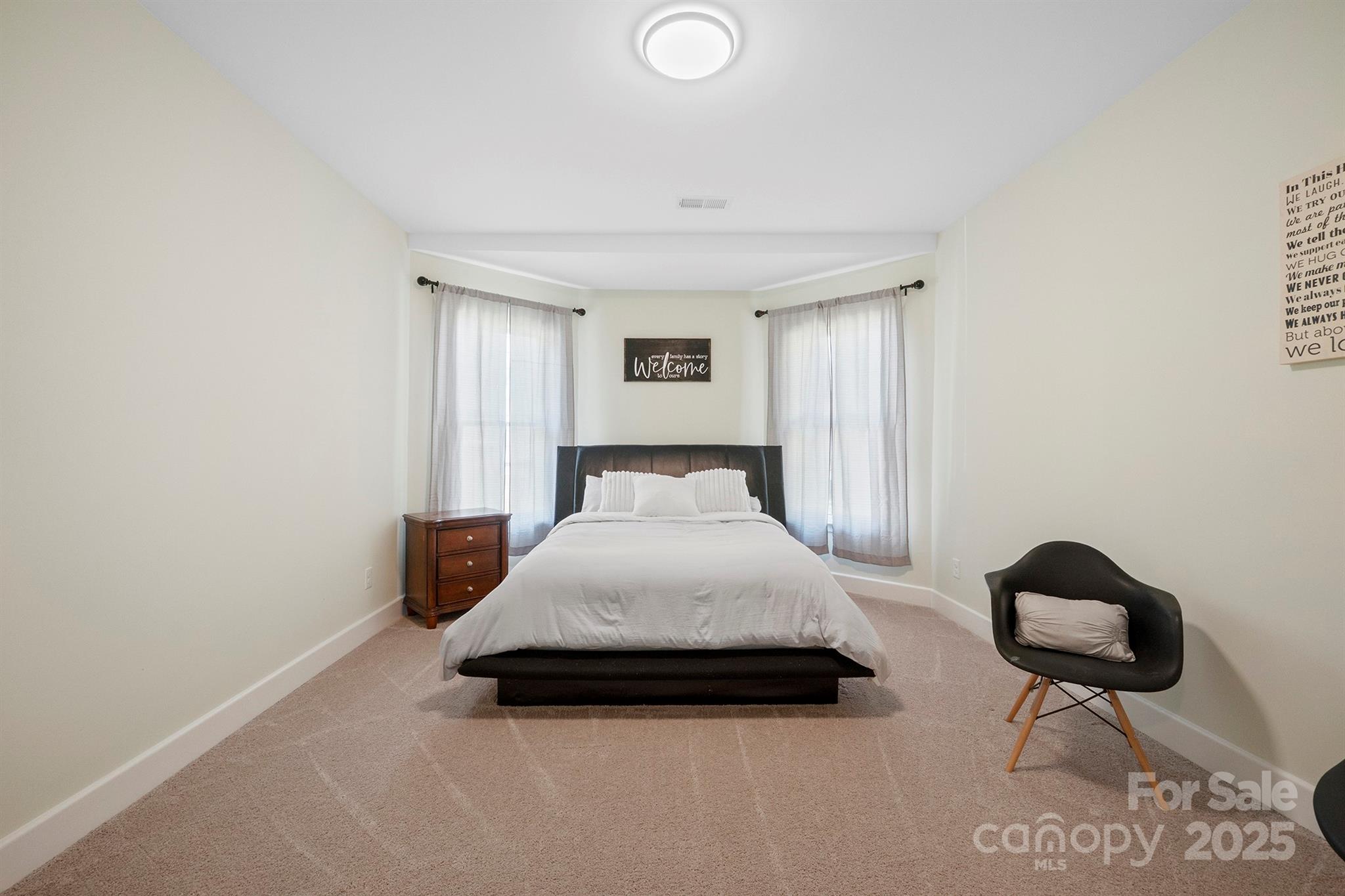 600 3rd Street Spencer, NC 28159 - Photo 16 of 27 a bedroom with a bed and chair