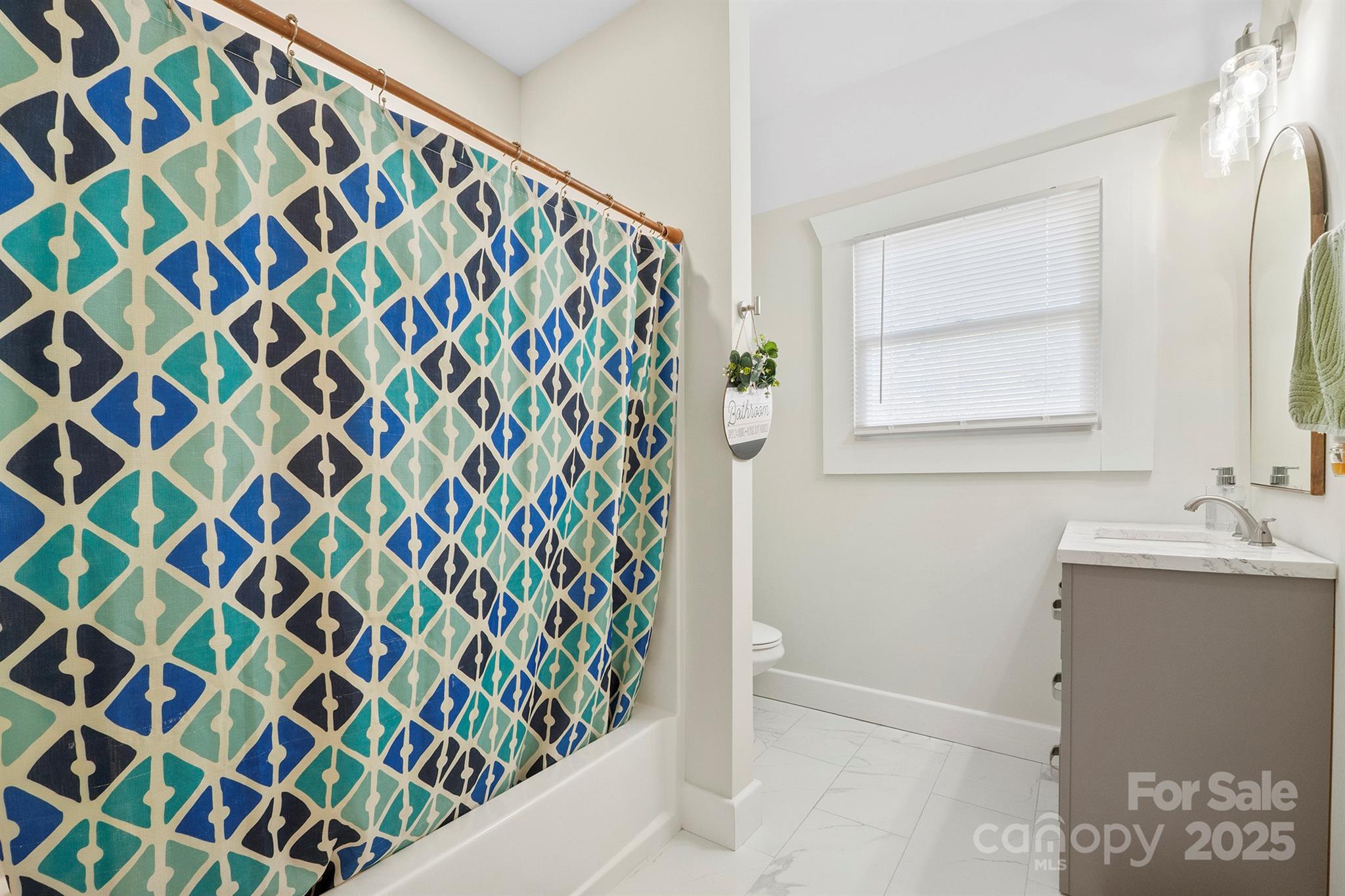 600 3rd Street Spencer, NC 28159 - Photo 18 of 27 a bathroom with a sink and a mirror