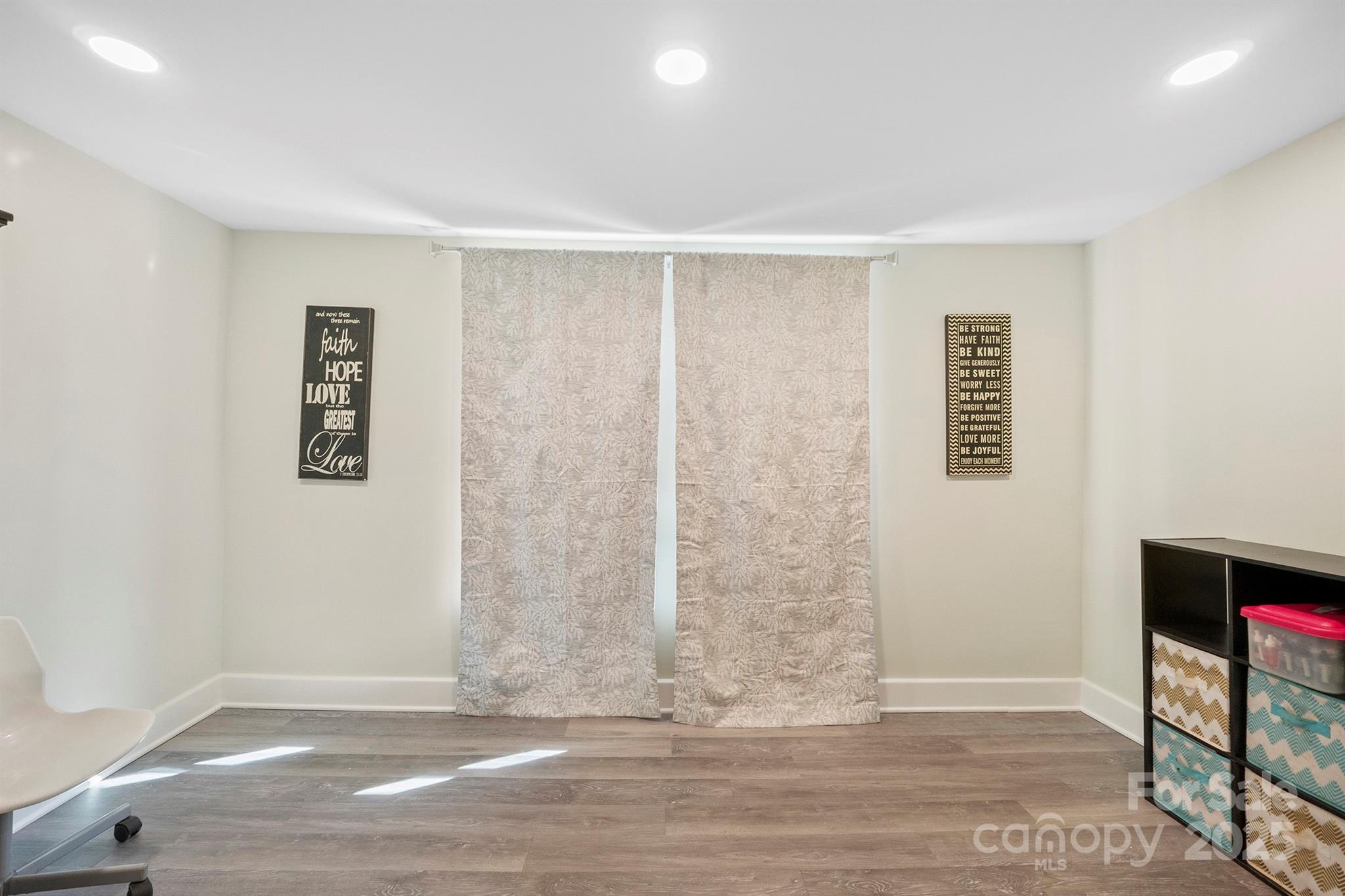 600 3rd Street Spencer, NC 28159 - Photo 23 of 27 a view of livingroom with hardwood floor and hallway