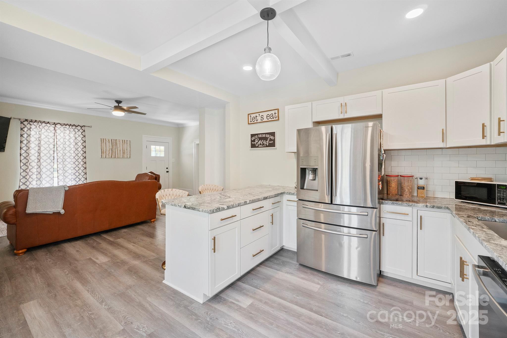 600 3rd Street Spencer, NC 28159 - Photo 3 of 27 a kitchen with stainless steel appliances granite countertop a refrigerator a stove a sink and a refrigerator