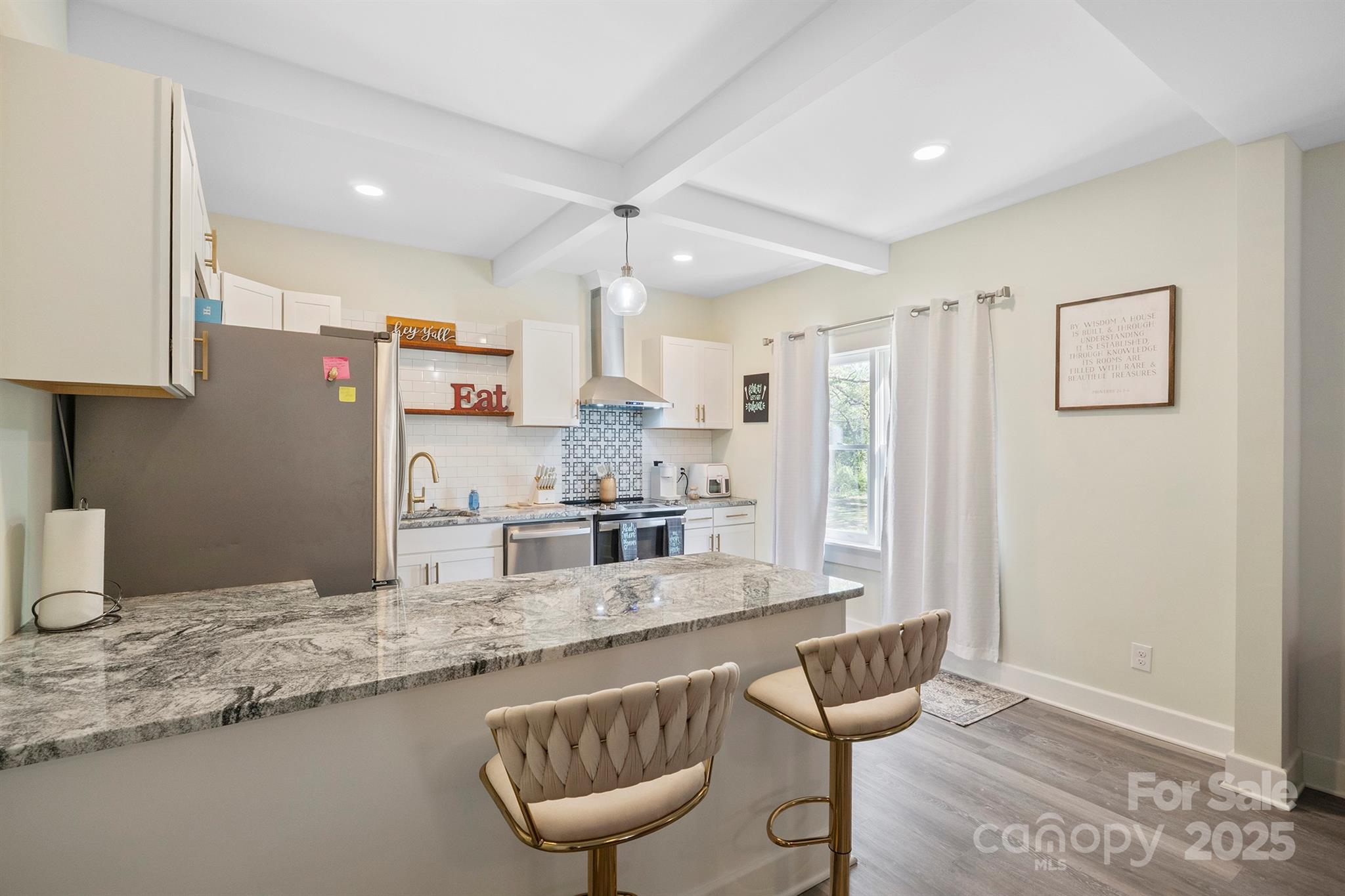 600 3rd Street Spencer, NC 28159 - Photo 6 of 27 a kitchen with stainless steel appliances granite countertop a sink stove and refrigerator