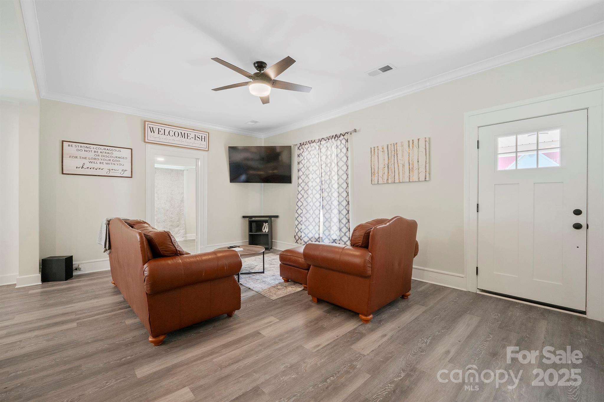 600 3rd Street Spencer, NC 28159 - Photo 8 of 27 a living room with furniture and a flat screen tv