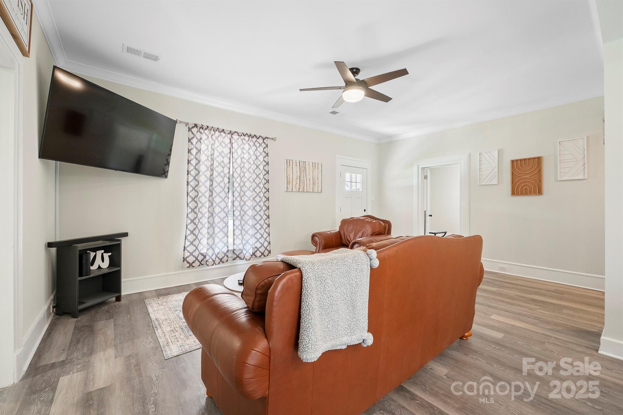 600 3rd Street Spencer, NC 28159 - Photo 9 of 27 a living room with furniture and a flat screen tv